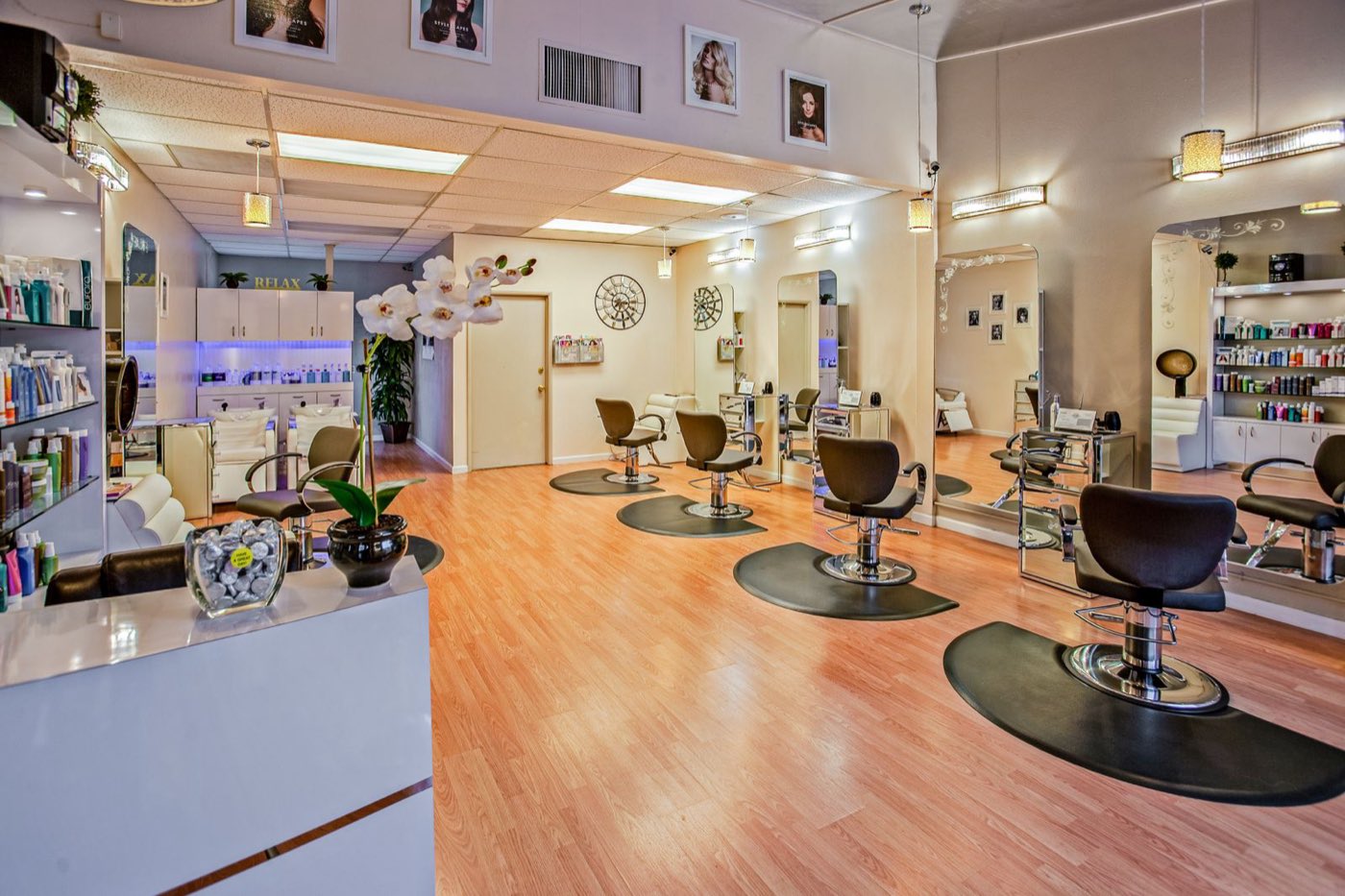 Salon styling chairs lined up on a bright floor